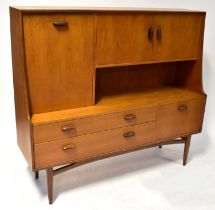 G-PLAN; a teak high top sideboard with a configuration of three cupboards and two drawers, on