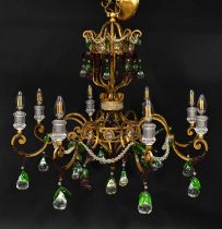 A gilt metal eight-branch electrolier with Murano glass drops in the form of clear pears and