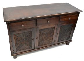 A modern mahogany-effect sideboard of three drawers over three rattan cupboard doors, 86 x 134 x