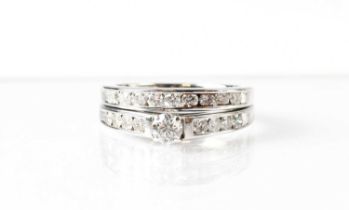 An 18ct white gold wedding ring in the form of a half eternity ring, set with eight diamonds,