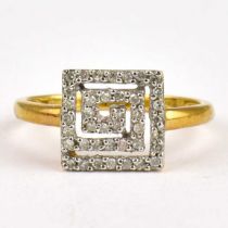 A 9ct gold dress ring with Greek Key cluster top, size O, approx. 2g.