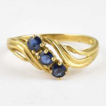 A 9ct gold ring with claw set sapphire to scroll shoulders, size O, approx. 1.9g.