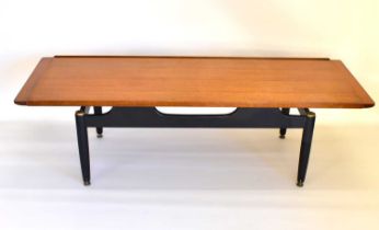 A 1960s/70s retro coffee table with teak top and black painted gilt-heightened base, 40 x 138 x