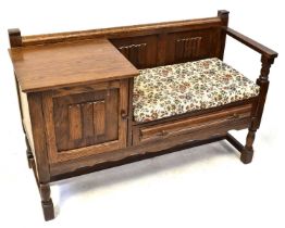 A mid century oak telephone table/bench with linenfold decoration, 68 x 107 x 42cm.