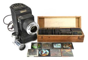A Magic Lantern stamped 'Johnson Oloscope' together with two lenses and a quantity of magic