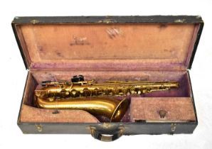 A Karl Meyer cased alto saxophone with etched decoration, mouthpiece and strap, length 72cm.