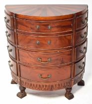 A reproduction demi-lune chest of twelve drawers, with inlaid top, on lion paw feet, 75 x 67 x