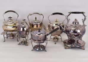 Various silver plated items comprising four spirit kettles, one with bone finial, two egg warmers,