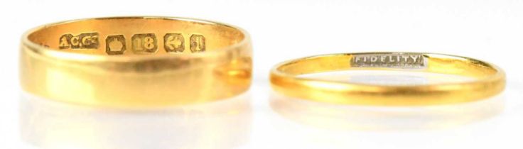 An 18ct gold wedding ring stamped 18, size Q 1/2, approx. 3.1g, together with one other indistinctly