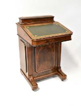 A 19th century walnut Davenport with stationery box top, gilt green leather pad to the lid, which