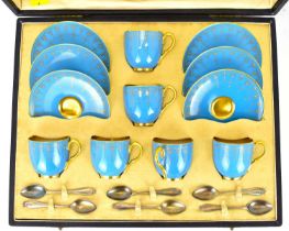 ROYAL WORCESTER; a set of six demitasse coffee cups and saucers in light blue, embellished with