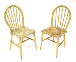 ERCOL; six Ercol and Ercol-style spindle back dining chairs, variously decoupage decorated in