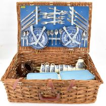 BREXTON; a vintage picnic set in wicker basket, with cutlery and ceramic plates.