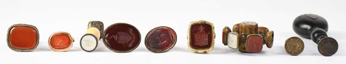 A small group of 19th century hardstone intaglio seals, comprising a carnelian fob seal carved