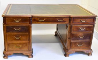 A large reproduction mahogany partner's desk with tooled green leather top and Greek key border,
