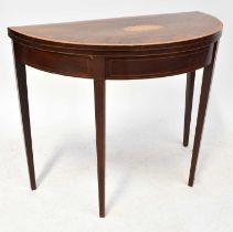 A Georgian inlaid mahogany demi-lune folding card table with fan motif to top, 73 x 44 x 89cm.