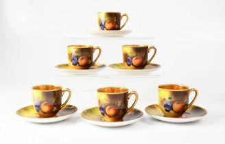 A Noritake hand painted coffee service of six coffee cups and saucers, with gilt washed interiors