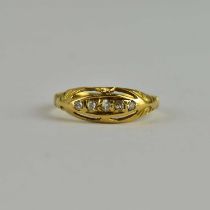 An 18ct gold diamond ring, the table set with a line of five graduated tiny diamonds, size N,