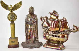 Two cast metal fireside companions, one a knight, height 37cm, the other with ship to the front,