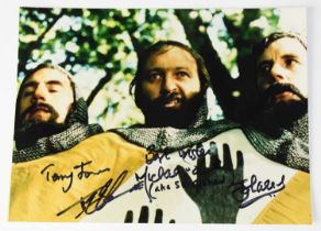 MONTY PYTHON; a colour image from 'Monty Python and the Holy Grail' signed by cast members Terry