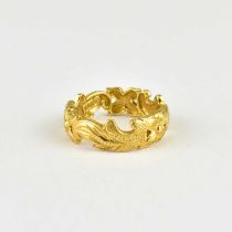 A 14ct gold Hawaiian wedding band with cut-out flowers and palm leaves, size J, approx. 3g.