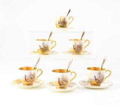 JAMES STINTON FOR ROYAL WORCESTER; a set of six hand painted coffee cups and saucers, with pheasants