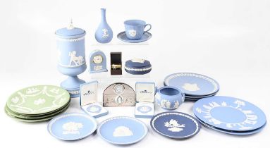 WEDGWOOD; a collection of jasperware, to include a blue urn with cover and finial of a young boy,