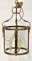 A brass conical hall lantern with satyr head and beaded decoration, height 82cm.