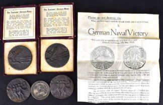 Four 'The Lusitania' replica (German) medals, two boxed, two loose, and one 'Please Do Not Destroy