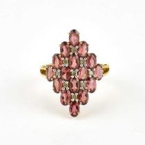 A 9ct gold contemporary dress ring, cluster setting of trapezium shape with claw set opal red/pink