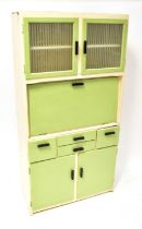 A c.1950s painted kitchenette with two glass cupboard doors over a drop-down work surface, over