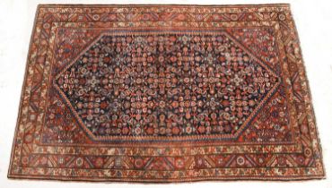 A Hamadan rug, Herati pattern on an indigo blue field, enclosed by three multi-pattern guard strips,