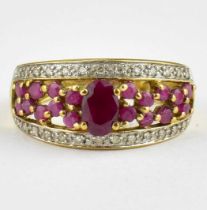 A 9ct gold ruby and diamond cluster dress ring, size O, approx. 3.2g.