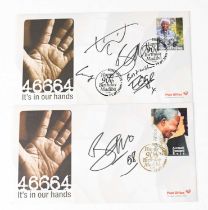 U2; two first day covers signed by members of the band to include Bono, Edge, and Larry Mullen (