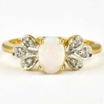 A 9ct gold dress ring, set with an opal flanked by white stone set floral shoulders, size N, approx.