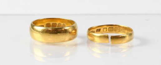 Two 22ct gold wedding bands, sizes N and O approx. (cut), combined approx. 10.5g (2). Condition