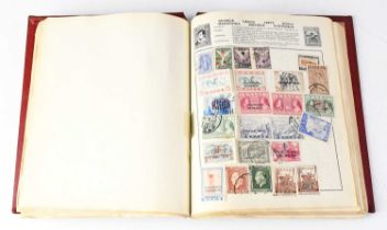 A 'Quickchange' schoolboy stamp album, partially filled with Great British and world stamps.