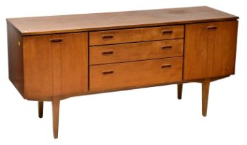NATHAN; a 1960/70s teak sideboard, central bank of three graduated drawers flanked by cupboards,