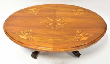 A Georgian-style inlaid walnut oval topped coffee table with inlaid decoration, on a matched