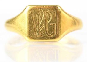 An 18ct gold signet ring initialled 'V P G', stamped 18, size P, approx. 5.4g.