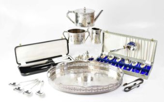 ELKINGTON & CO; a silver-plated three-piece tea service with bone heat spacers, an oval galleried