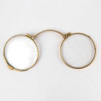 A pair of 9ct gold collapsible spectacles (lorgnettes) (af). Condition Report: Handle missing