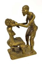An African bronze figure of a dentist extracting a tooth from a seated client, height 31cm.