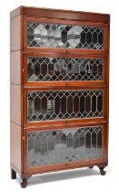 A mahogany four-section solicitor's bookcase with astragal glazed up-and-over doors, 150 x 88 x