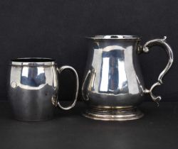 A George III hallmarked silver baluster form mug with ear-shaped handle, initialled 'A' within