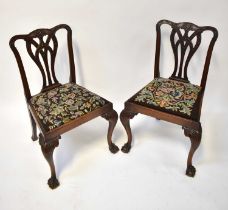 A pair of 19th century Chippendale-style dining chairs with tapestry covered seats (2).