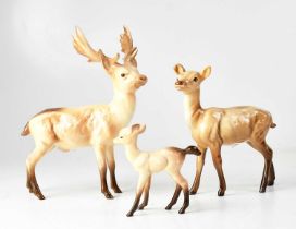 BESWICK; a family of three deer figures, comprising a stag, a doe and a fawn, height of tallest 20cm