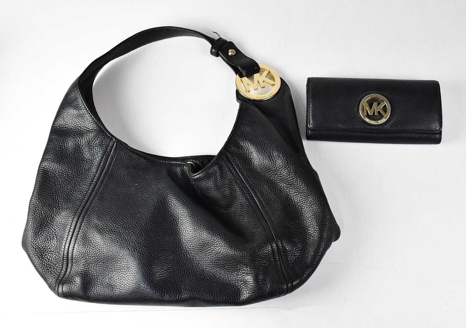 MICHAEL KORS; a black pebbled leather hobo shoulder bag, with a similar Michael Kors purse/wallet (
