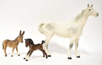 BESWICK; three figures comprising a dappled grey horse, a foal and a small ass, height of largest