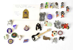 A collection of pins and badges, to include a Pink Floyd 'Division Bell' pin badge, a Queen 'Juggler